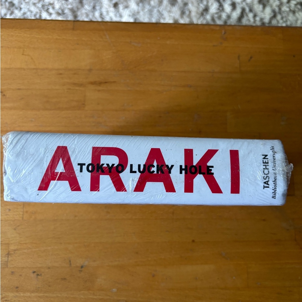 Taschen Araki Tokyo Lucky Hole with Red and Black Text